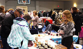 Visitors browse vendors’ wares at the Christmas Arts and Craft Fair in 2016. - Bulletin File Photos