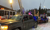 BJ Egerter and his family take part in the Christmas Car Parade with their decorated vehicle and trailer. - Tim Brody / Bulletin Photos