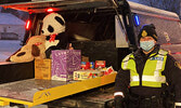 Sioux Lookout OPP Community Mobilization/Safety Officer Constable Andrea DeGagne with donations of toys and non-perishable food items donated at the event to help local families this Christmas. - Tim Brody / Bulletin Photos