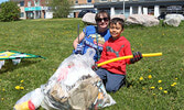 Jenn Bryan (left) and Trapper Siblock show off the garbage they helped collect.    Tim Brody / Bulletin Photo