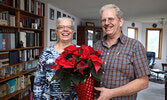 Bill and Susan Hochstedler with flowers they received in recognition of their cleanup efforts.   Bulletin File Photo