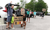 Community members show their support for people of colour, who experience racism and discrimination, forming a Corridor of Love along Wellington Street last Thursday evening. - Tim Brody / Bulletin Photo