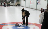 Cathy Bowen sweeps a stone to the button during the Draw to the Button event, part of Curling Day in Canada activities at the Sioux Lookout Golf and Curling Club.    Tim Brody / Bulletin Photo