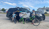 Jesse, Samantha and Tyler Falkingham, with Constable Samantha Lee.     Sioux Lookout OPP / Submitted Photo