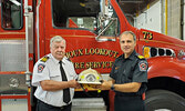  Dennis Leney (left) accepts his promotion to deputy fire chief from Municipal Emergency Services Manager/Fire Chief Robert Popovic.    Municipality of Sioux Lookout Facebook Image