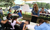 Gabrielle Cosco checks on her drawing class students’ progress. - Tim Brody / Bulletin Photo