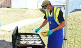 Rotary Club of Sioux Lookout member Lorenzo Durante prepares a batch of blueberry pancakes. - Tim Brody / Bulletin Photo