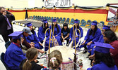 Victor Lyon, far right, leads Grade 8 students from Sioux Mountain Public School in drumming during their 2019 graduation ceremony.  - Bulletin File Photo
