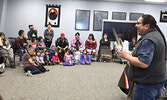 Elder Ronnie Beaver (standing far right) addresses students and conference delegates. - Tim Brody / Bulletin Photo