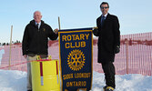 Rotarians Knowles McGill (left) and Lawrence Durante (right) pose for a photo in a previous year,  promoting the Rotary Club of Sioux Lookout’s End of Winter contest.    Photo courtesy Dick MacKenzie