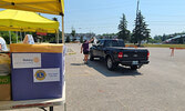 Reeti Meenakshi Rohilla / Bulletin PhotoSioux Lookout Lions Club member Bev Piche hands a meal to a customer at their drive-thru barbecue event.      