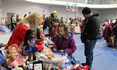 Visitors to the annual Christmas Arts and Craft Fair browse the wide variety of wares for sale by local bakers and artisans.   Tim Brody / Bulletin Photo