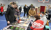 Visitors to the annual Christmas Arts and Craft Fair browse the wide variety of wares for sale by local bakers and artisans.   Tim Brody / Bulletin Photo