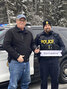 Pickle Lake Mayor Dwight Monck (right) and Constable Jason Paquette ask people to Arrive Alive and drive sober this holiday season.     Photo courtesy Ontario Provincial Police
