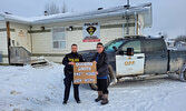 Wapekeka First Nation Chief Brennan Sainnawap (right) and Constable Boe Rogers ask people not to drink and drive this holiday seson.     Photo courtesy Ontario Provincial Police