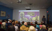 The Library’s digital media room was at full capacity as the packed crowd filled the room for the film screening. - Jesse Bonello / Bulletin Photo