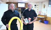 Manager of Emergency Services/Fire Chief Jeremy Funk (left) and Fire Prevention and Training Officer Terry Baker display winter safety messages and equipment used by the fire service on March 1 during this year’s Winter Festival.   Tim Brody / Bulletin Ph