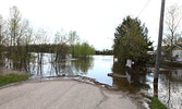 Flood waters cover a Sioux Lookout roadway last spring.   Bulletin File Photo
