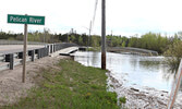 The walking bridge on the Travel Information Centre grounds (right) and the bridge over Pelican Creek (left), as observed on May 28.   Tim Brody / Bulletin Photo