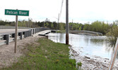 The walking bridge on the Travel Information Centre grounds (right) and the bridge over Pelican Creek (left), as observed on May 28. Tim Brody / Bulletin Photo