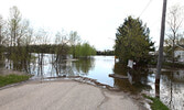 Pelican Lake has flooded the area where Ethel Street and Fourth Avenue meet. Tim Brody / Bulletin Photo