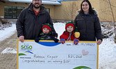 December draw winner Rebecca Kiepek (far right), with husband Eric Kiepek (far left), and their children Owen (second from right) and Wyatt (second from left).  - Tim Brody / Bulletin Photo