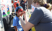 Braedon Wesley getting a Spiderman face-painting at Fresh Market Foods’ Family Carnival.      Reeti Meenakshi Rohilla / Bulletin Photos