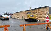 Workers install the shoring structure at the Red Apple store.    Tim Brody / Bulletin Photo