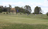 Golfers make their final approach on Hole 9.     Tim Brody / Bulletin Photo