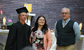 Hunter Atwood (left) receives his diploma from SHS Principal Emily Hamilton (centre) and SHS Vice-Principal Darren Johnson (right).   Tim Brody / Bulletin Photo
