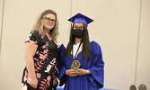 Nellie Angeconeb is presented the Attendance Award by school staff member Nikki Catlin-Gosse.   Tim Brody / Bulletin Photo