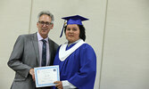 Grade 8 Teacher Bruce Meyers presents Adam Hill with his diploma.   Tim Brody / Bulletin Photo