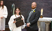 McKenzie Horde (left) receives the Sacred Heart School Outstanding Character Award from principal Brody Marsonet. - Tim Brody / Bulletin Photos