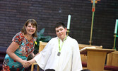 Sacred Heart School vice-principal Kim Savoie (left) presents Patrick Bellerose with a Catholic Graduate Expectation Medal. - Tim Brody / Bulletin Photos