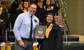 Charmaine Morris (right) receives her diploma from Wahsa Distance Education Centre principal Darrin Head (left). - Jesse Bonello / Bulletin Photo