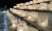 Ice candles light up the night with their soft glow at Sacred Heart/Northway Cemetery.    Tim Brody / Bulletin Photo