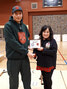 Junior Canadian Ranger Ian Kakekaspan receives a plaque and cheque from Kerry Vance, a director of Canada Company. - Corporal Lori Kendall, Canadian Rangers