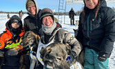 Jesse Terry (second from left) congratulates wife Mary England (second from right) after the completion of her race at the Canadian Challenge Sled Dog Race. The couple is joined by their children Tevai (far left) and Miali (far right).   Photo courtesy of