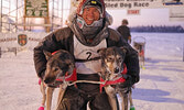 Jesse Terry, winner of the Canadian Challenge, with his lead dogs Flame and Abby.   Photo courtesy Jim Williams