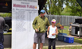 Brendan Sitar (left) and daughter Reese Sitar collect their first place prize for the ten-and-under division. - Jesse Bonello / Bulletin Photos