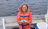 Kendall Egerter displays one of her catches from the day. - Jesse Bonello / Bulletin Photos