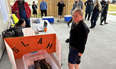 SLAH volunteers weigh in participant’s catches and add their results to the leader board.    Tim Brody / Bulletin Photo