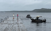 Teams make their way to the dock at Farlinger Park (Town Beach) to enter their catch at the weigh station. Tim Brody / Bulletin Photo