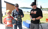 SLAH President Jeremy Fun (right) presents third place plaques to Ron Laverty (centre) and his grandson Isaac Laverty (left).   Tim Brody / Bulletin Photo