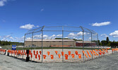 215 orange t-shirts adorn the fence at the Frenchman’s Head (Lac Seul First Nation) baseball diamond to pay tribute to the lost children.      Photo courtesy Alisha Dasti-Hill