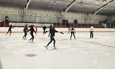 Kurt Browning on ice with skaters practicing spins and dances.    Andre Gomelyuk / Bulletin Photo