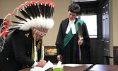 Bruno Rossi is sworn in as Lac Seul Police Service Chief of Police on May 2 by Her Worship Shiree Scribner, Justice of the Peace. Tim Brody / Bulletin Photo