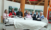 Members of the Legion Ladies Auxiliary pose with hospital and foundation staff alongside the new, longer hospital bed they fundraised for.  From left: Kate Singbeil - SLMHC Patient Care Manager/Med Surge/ER/Day Med, Melissa Slade - Donor Relations/Operati