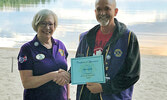 Lions Club District Governor Shirley Koroniak (left) presents Sioux Lookout Lions Club President Chris Larsh with a certificate recognizing his 30 years of service with the club. - Photos Courtesy Sioux Lookout Lions Club