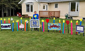 Althea George standing next to the lawn display highlighting her 80th birthday. - Photo courtesy of Lisa Larsh